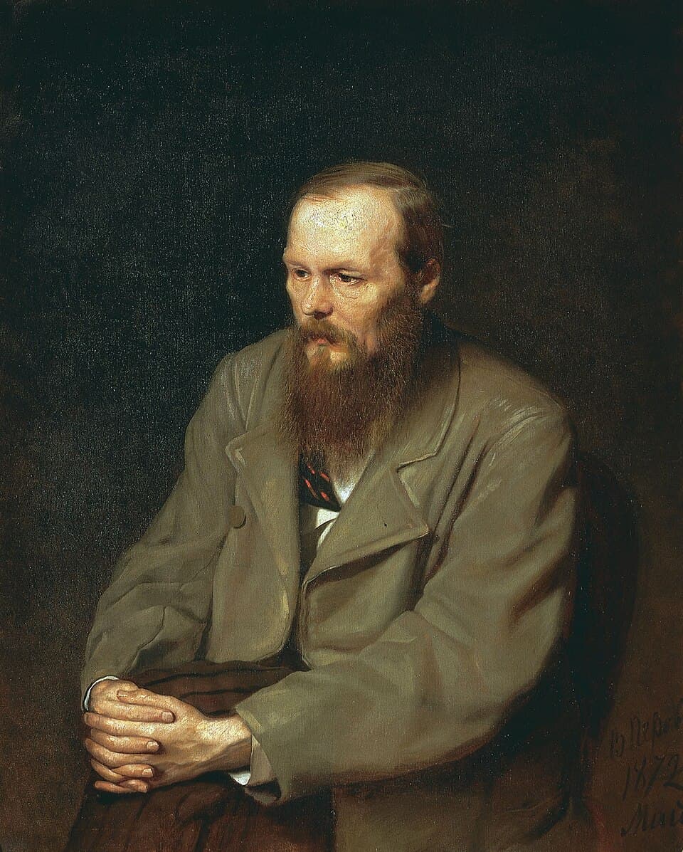 Vasily Perov’s portrait of Dostoevsky seated with hands clasped.