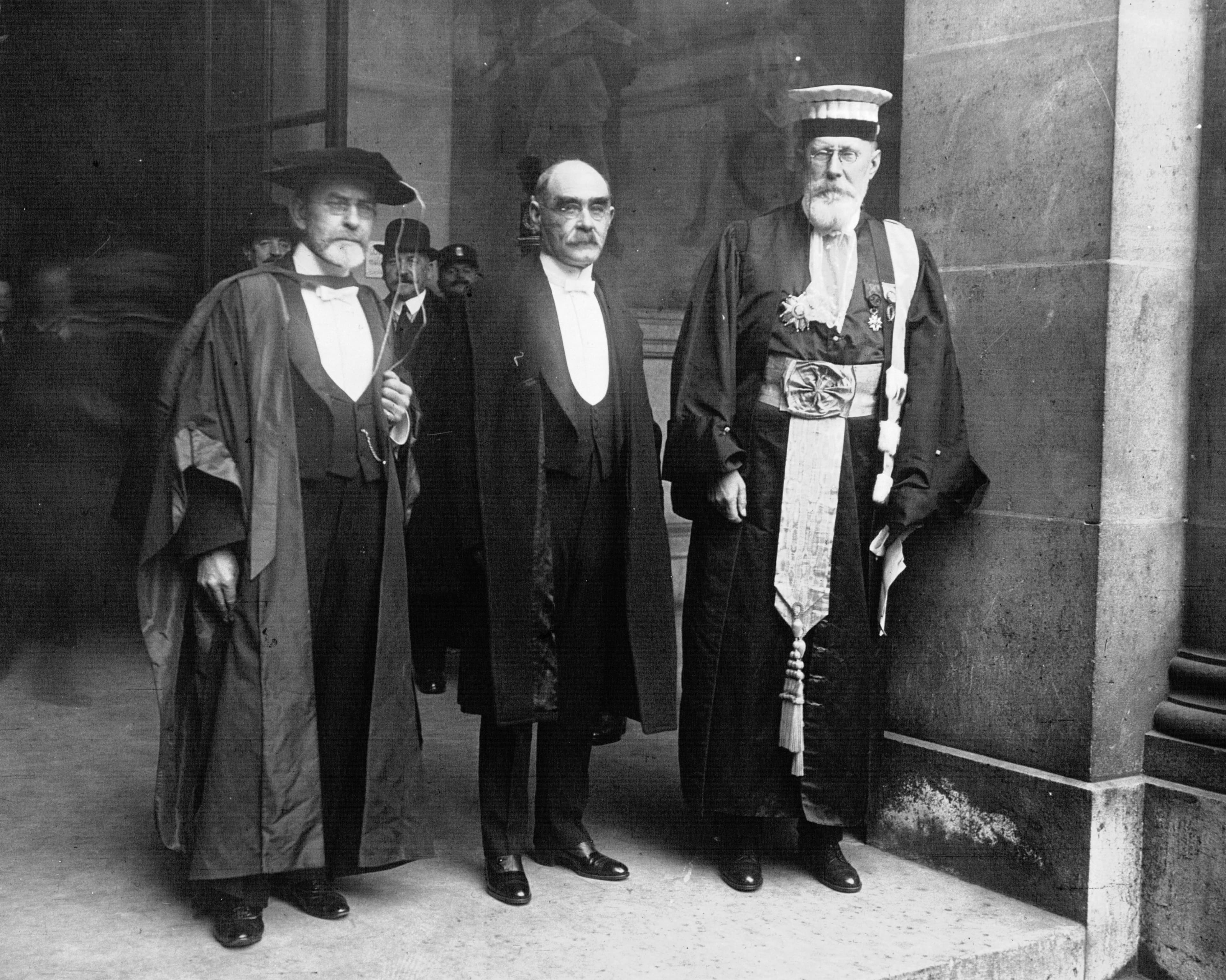James George Frazer, the man at the left of a 1921 group photograph, in academic robes and a broad hat.